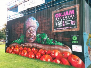 Painted hoarding promoting Oxjam Chiswick music festival in London.