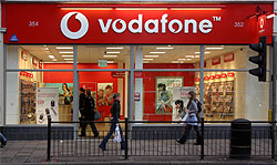 A photograph of the outside of a Vodafone shop.